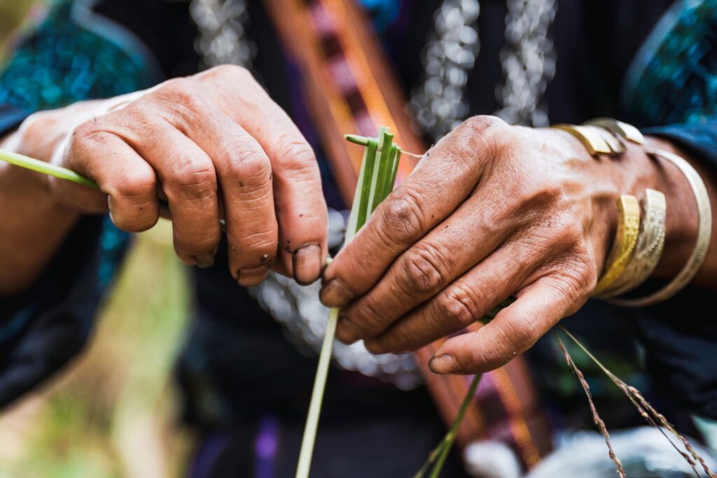 hands weaving natural fibers minimalist